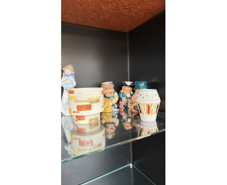 Eclectic ceramic lot featuring character toby jugs, a Mid-Century modern planter, a decorative hand-painted vase, and a porce
