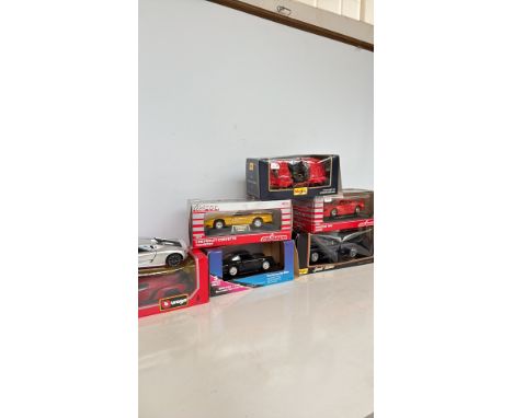 Lot of six die-cast model cars, including Maisto, Bburago, and Majorette brands. Features Porsche, Corvette, Ferrari, and mor