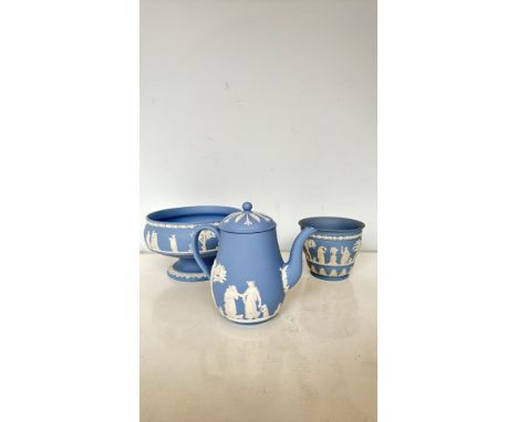 Wedgwood Jasperware three-piece lot features a blue and white bas-relief pedestal bowl, teapot, and planter with classic neoc
