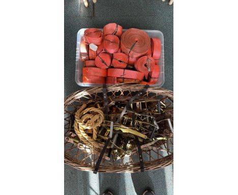 Large lot of heavy-duty ratchet straps, tie-downs, and securing equipment. Includes orange webbing straps, ratchet mechanisms