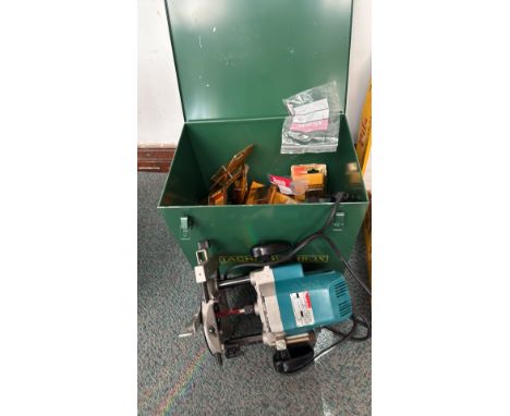 Makita 3612BR plunge router, 1600W, includes a metal tool storage box and assorted router bits.						