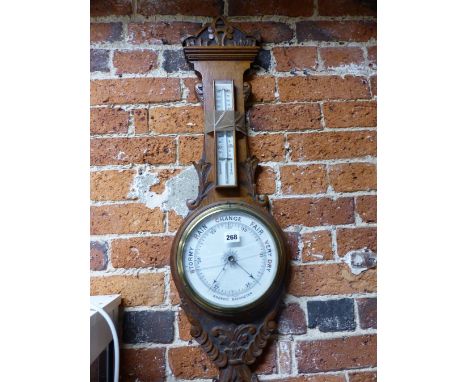 A VICTORIAN OAK BANJO CASED ANEROID BAROMETER, THE MERCURY THERMOMETER AND THE DIAL BELOW IN WHITE CERAMIC