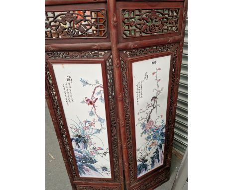 A PAIR OF CHINESE CERAMIC PANELS DECORATED WITH BIRDS AND FLOWERS WITHIN HARDWOOD FRAMES