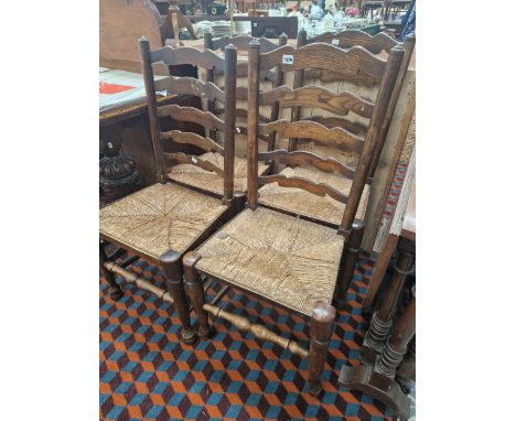 A SET OF FOUR RUSH SEAT LADDER BACK CHAIRS 