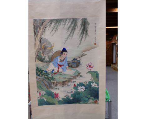 A CHINESE SCROLL PAINTED WITH A GIRL PAINTING LOTUS BELOW AND WILLOW TREE TO WHICH HER WATER BUFFALO IS TIED.   93 x 67cms.