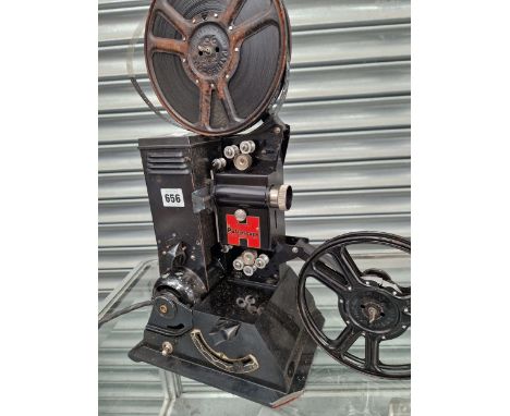 A PATHESCOPE FILM PROJECTOR WITH REELS OF FILM AND LEATHER CASE