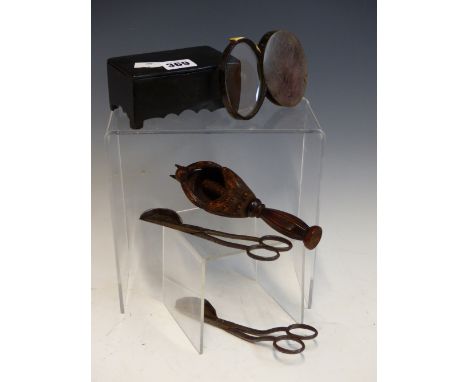 A CARVED WOODEN SQUIRREL NUT CRACKER, THE CANDLE TRIMMER SCISSORS, A PAPIER MACHE BOX AND A HORN CASED MAGNIFYING GLASS 