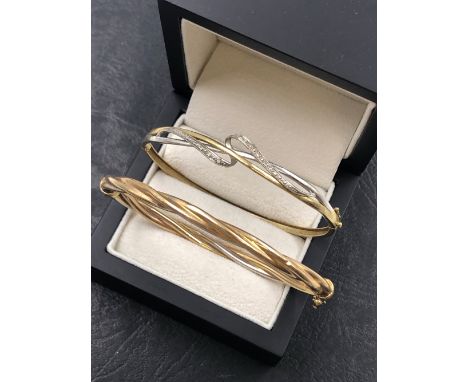 A 9ct HALLMARKED GOLD DIAMOND SET HINGED BANGLE, TOGETHER WITH A FURTHER HINGED TWISTED BANGLE STAMPED 9 ITALY, ASSESSED AS 9