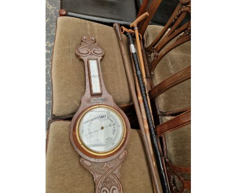 A BAROMETER AND WALKING STICKS.