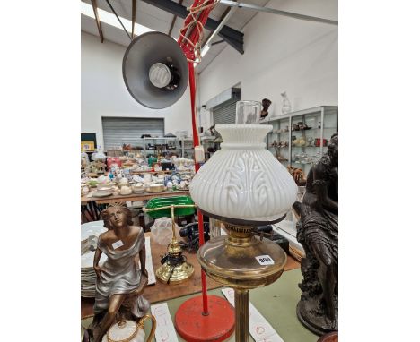 AN ANGLE POISED TYPE FLOOR LAMP AND A OIL LAMP