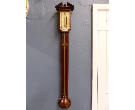 AN AIANO BARBERS POLE BANDED MAHOGANY STICK BAROMETER, THE SILVERED DIAL FLANKED BY A MERCURY THERMOMETER, THE WELL COVER HEM