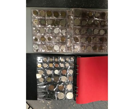TWO ALBUMS OF VARIOUS VINTAGE COINS. 