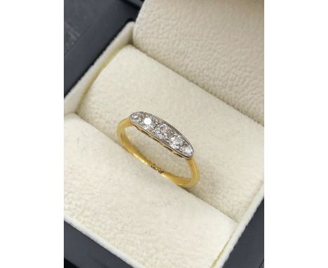 AN ANTIQUE FIVE STONE GRADUATED DIAMOND BOAT STYLE RING. STAMPED 18ct.  FINGER SIZE O 1/2. WEIGHT 2.61grms.