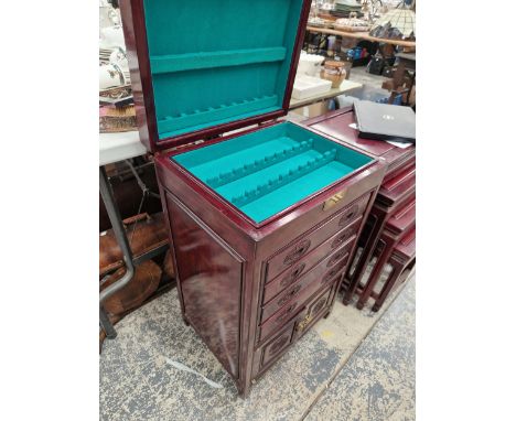 A VINTAGE ORIENTAL STYLE CUTLERY CANTEEN CABINET. 