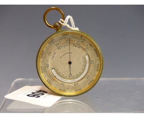 A POCKET BAROMETER WITH INSET MERCURY THERMOMETER IN A GILT CASE.   Dia. 5cms.
