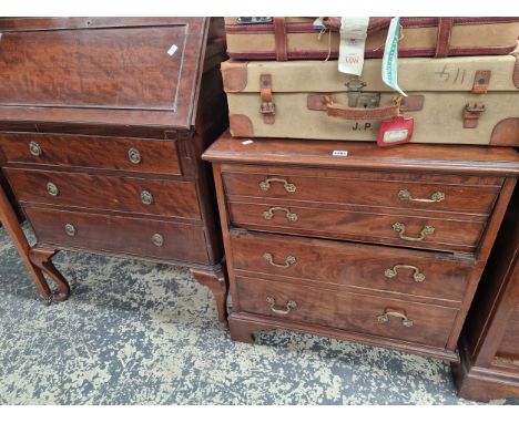 A GEORGIAN MAHOGANY COMMODE AND A MAHOGANY BUREAU 