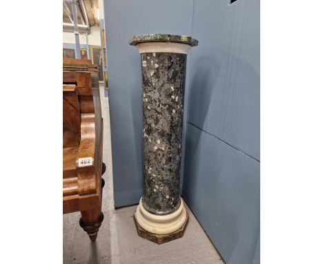 AN ANTIQUE SCAGLIOLA SIMULATED GREY MARBLE COLUMNAR STAND WITH WHITE MARBLE RING AT THE FOOT AND BELOW THE OCTAGONAL GREEN ST