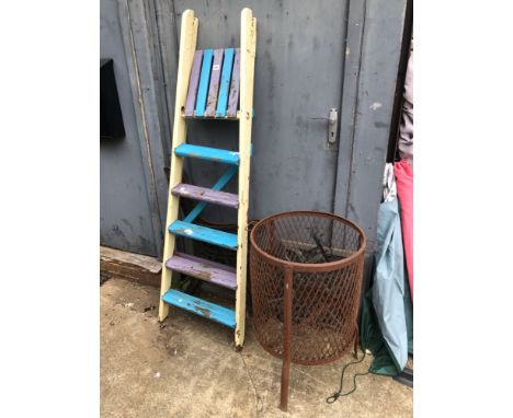 A BRAZIER, PAINTED BENCH ENDS, STEP LADDER, ROLLS OF CHICKEN WIRE, GARDEN EDGING ETC