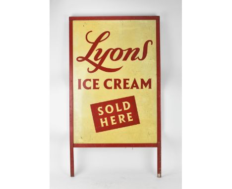 A vintage 'LYONS ICE CREAM' advertising tin sign, reading 'LYONS ICE CREAM SOLD HERE' in red lettering on cream ground, 99 cm