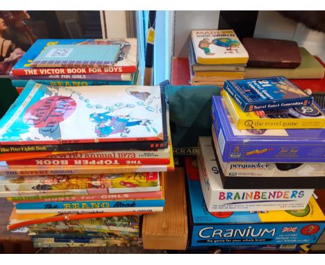 Mixed children's games and toys to include Pictionary and Taboo together with a small quantity of books and die cast vehicles