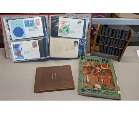 A mixed lot to include a miniature set of Dickens books, First Day covers, and two books Location: 