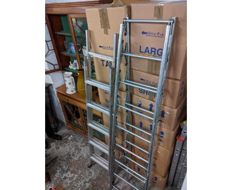 A three way ladder, another folding ladder, and a painter and decorator ladder with four extensionsLocation: 