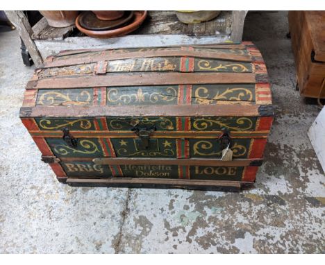 A vintage painted trunk with wooden and metal bands Location: 