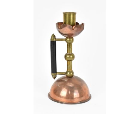 A late 19th century Arts &amp; Crafts copper and brass candlestick in the manner of Christopher Dresser, possibly for Barnum 