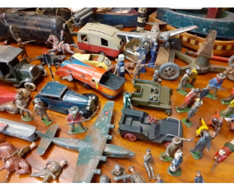 Vintage toys to include lead soldiers, tin plates vehicles and Dinky aircraft, all well played, together with wooden trugs an