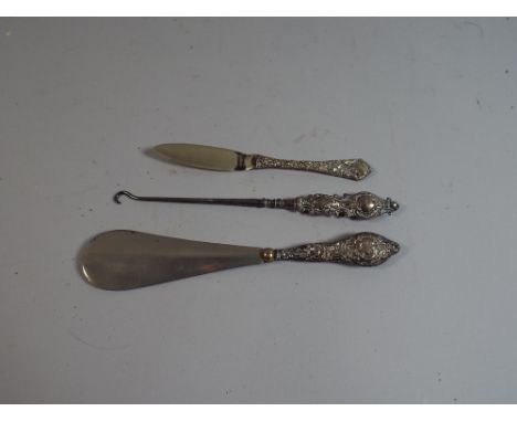 Three Silver Handled Items to Include Shoe Horn, Button Hook and Butter Knife
