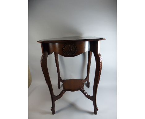 An Edwardian Mahogany Shaped Top Occasional Table with Shell Carving, Stretcher Shelf and Extended Cabriole Supports 