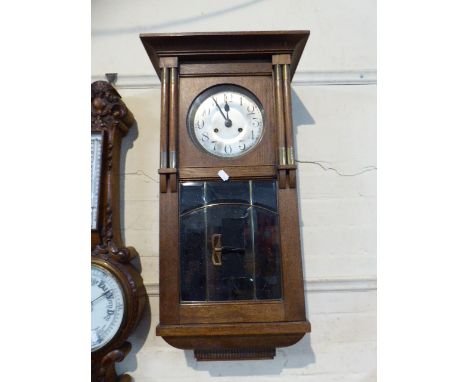 An Edwardian Oak Wall Clock with Glazed Pendulum Box, 74cm high 