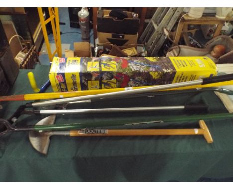 A Collection of Garden Tools, to Include Lawn Edger, Weeders, Hoe etc