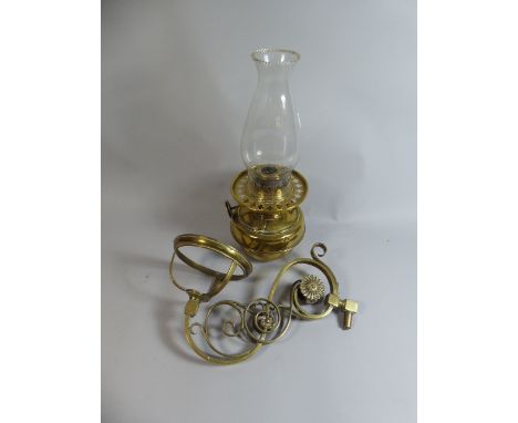A Victorian Brass Oil Lamp with Wall Hanging Swivelled Bracket 