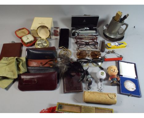 A Tray of Sundries to Include Pens, Hip Flask, Omega Watch Box, Alarm Clocks, Vintage Fan etc