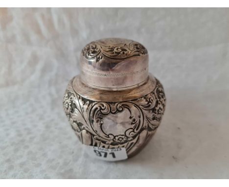 A bottle shaped embossed tea caddy with pull off cover, London 1892, 150g