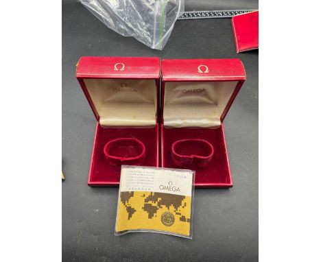 Two red OMEGA wrist watch boxes
