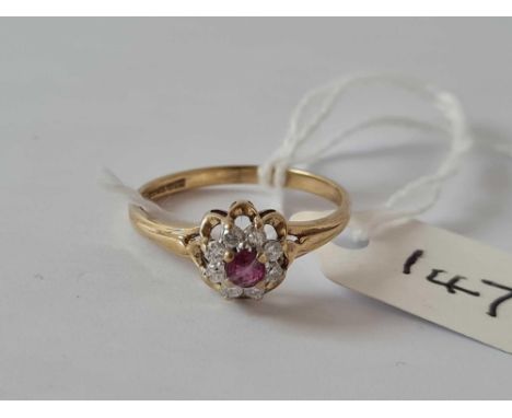 A fine quality ruby and diamond cluster ring 9ct Size N