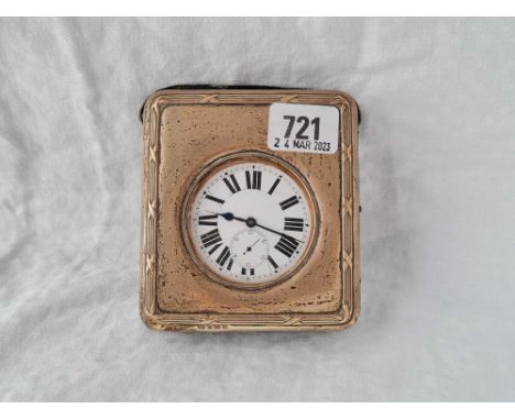A silver cased travelling clock, the clock with Roman Numerals to the enamel dial, seconds dial, 4" high, Birmingham 1910 