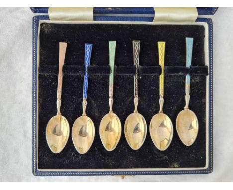 A box set of six enamel decorated tea spoons, Birmingham 1964 by T&amp;S