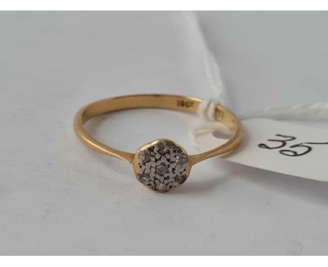 A diamond circular cluster ring in 18ct gold size R 1.8g inc