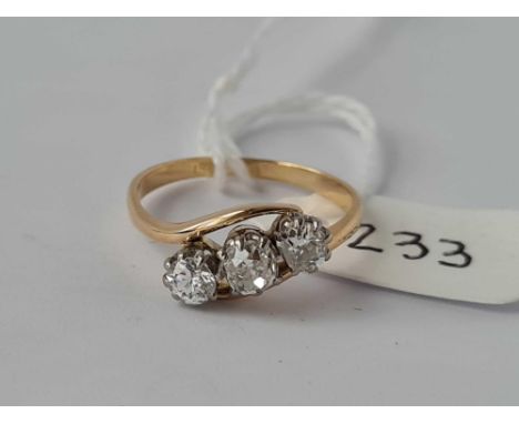 Antique Edwardian 3 stone diamond crossover ring, in 18ct andPlatinum (marked in shank) the total weight 0.85 cts of diamonds