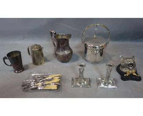 A collection of silver plated and steel items including, and ice bucket, a jug, a coffee pot, a inkwell in the shape of a cat