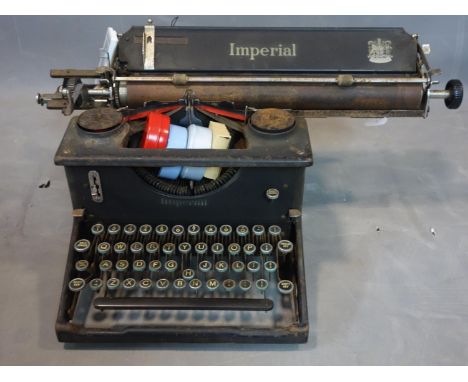 A vintage Typewriter Imperial George the 5th with a collection of Ribbons. 