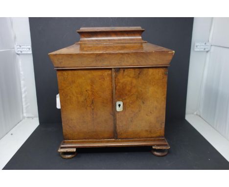 A Victorian walnut workbox, having two turned handles, mother of pearl escutcheon, hinged lid revealing reverse glass paintin
