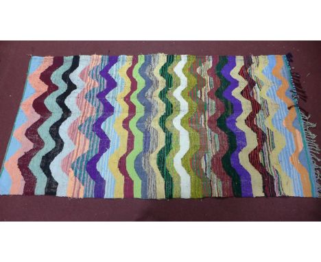 A vintage Moroccan Berber kelim, with multi-coloured wavy design, 290 x 123cm 