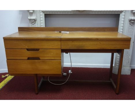 A mid 20th century Uniflex desk, with hinged lid revealing mirror to interior, having three drawers, bearing label for Unifle