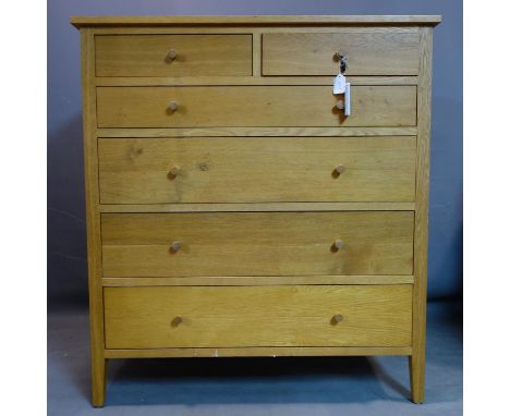 A contemporary oak chest of two short over four graduating drawers, on square tapered feet, H.115 W.105 D.52cm 
