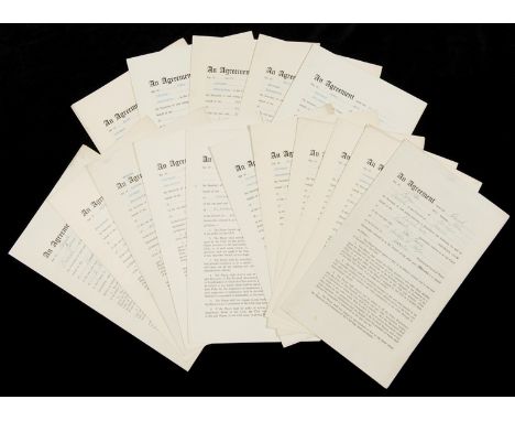 A superb group of 24 playing agreements for Manchester United footballers from the Busby Babes era between 1954 and 1956,each