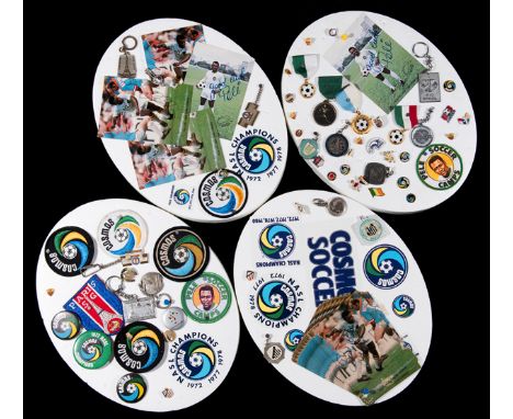 Cosmos and Pele memorabilia,comprising four oval-shaped polystyrene blocks with a quantity of pin badges, button badges, patc